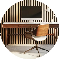 Modern home office setup featuring a wooden desk, computer monitor, and mid-century modern swivel chair against a vertical wood slat accent wall.